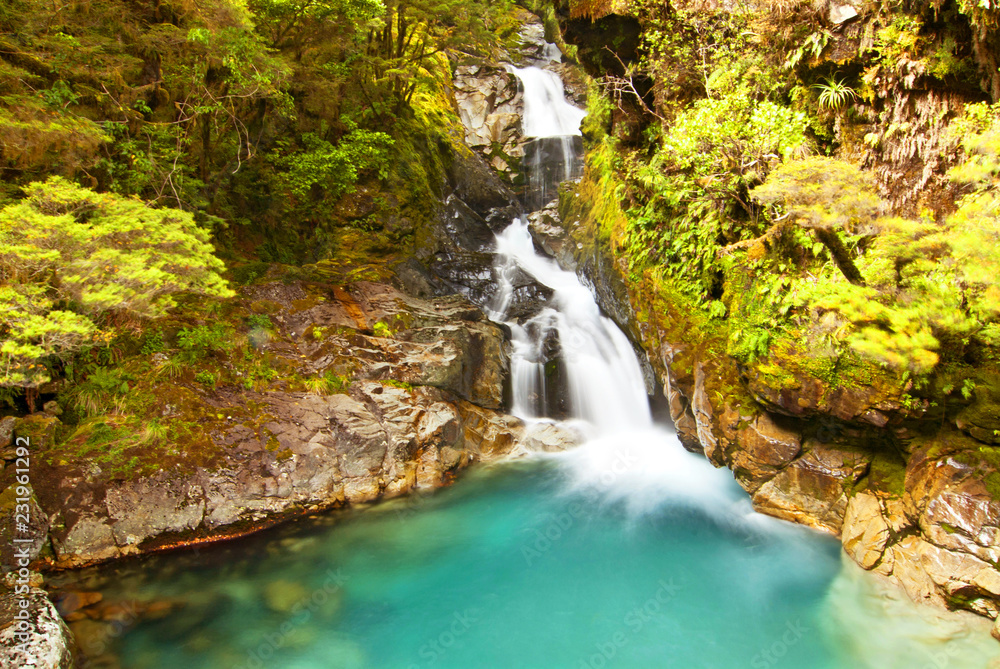 Waterfall on Cleddau river near Milford Highway in Fiordland National Park, New Zealand.
