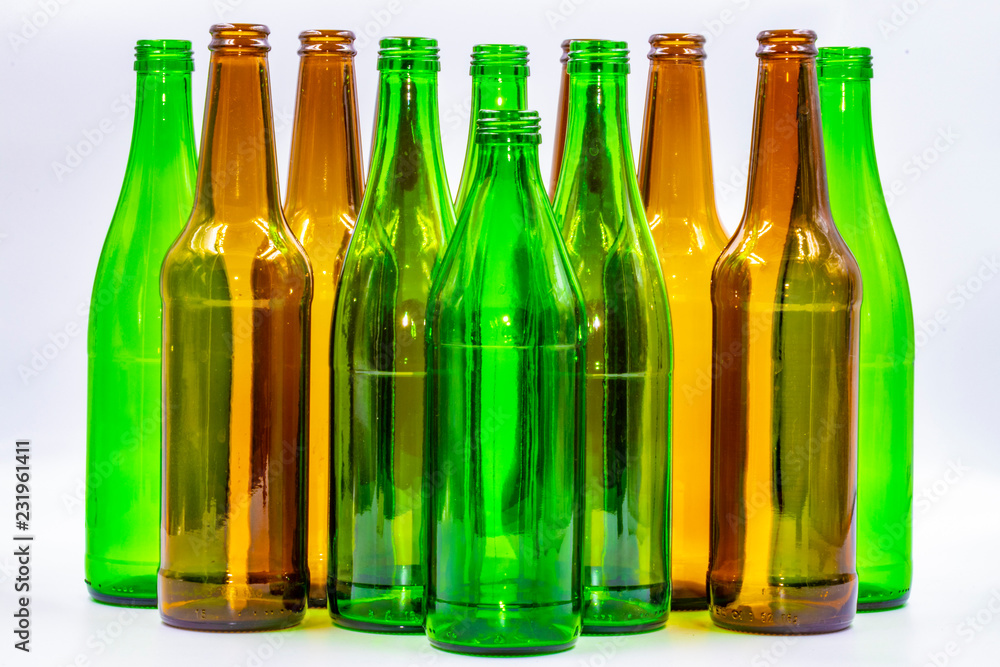 Colored empty glass bottles on white background Colored empty glass bottles on white background