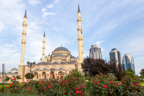 Grozny, Russia: 10.07.2015. Daily life in Chechen Republic. Main mosque of the Chechen Republic - Akhmad Kadyrov Mosque (Heart of Chechnya) and and skyscrapers of Grozny-city