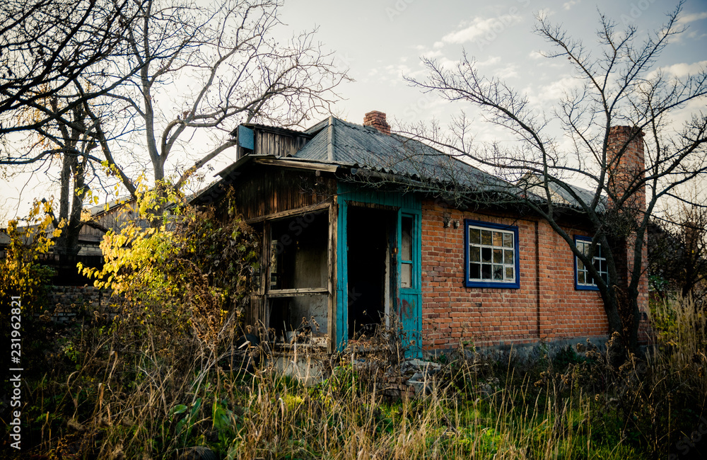 Old abandoned brick house among the autumn old garden Old abandoned brick house among the autumn old garden