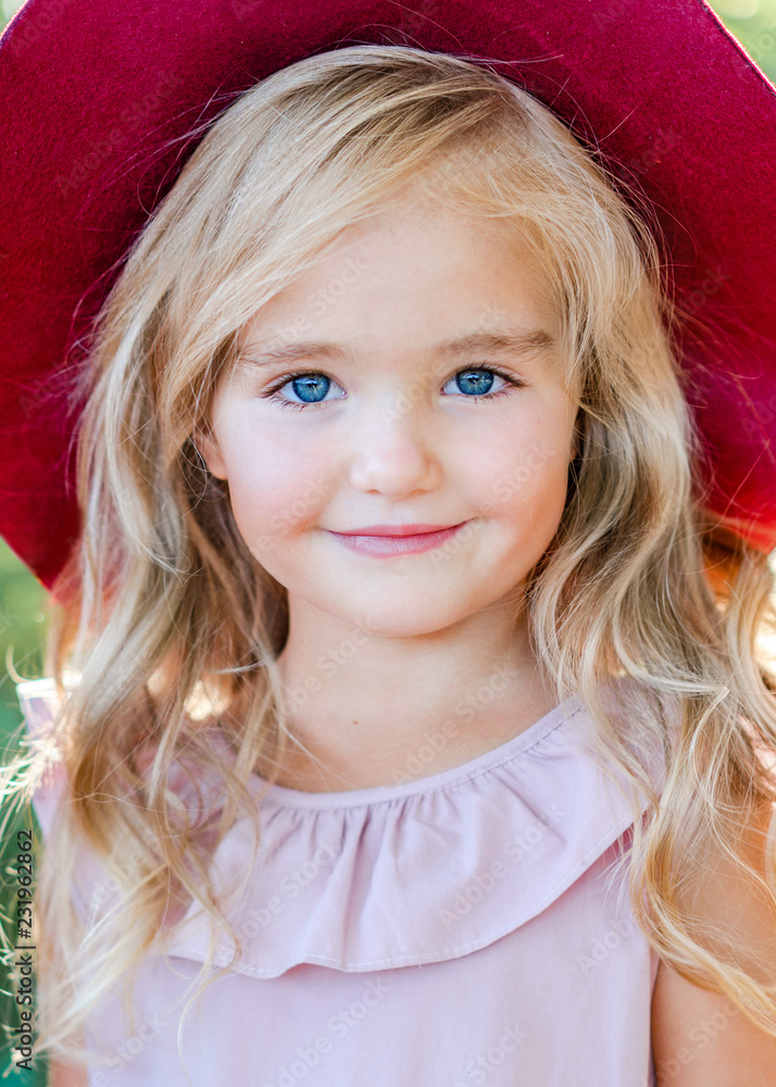 portrait of little girl outdoors in summer portrait of little girl outdoors in summer