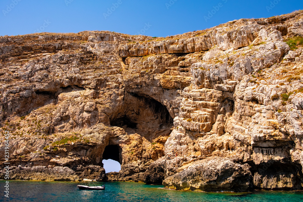 Alghero, Sardinia, Italy - Rocky islands and limestone cliffs of the Capo Caccia cape at the Gulf of Alghero