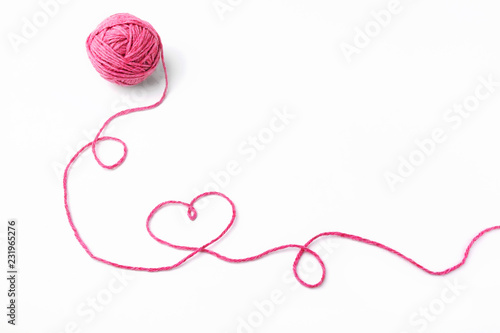 Fototapeta Pink thread, heart and tangle on white background