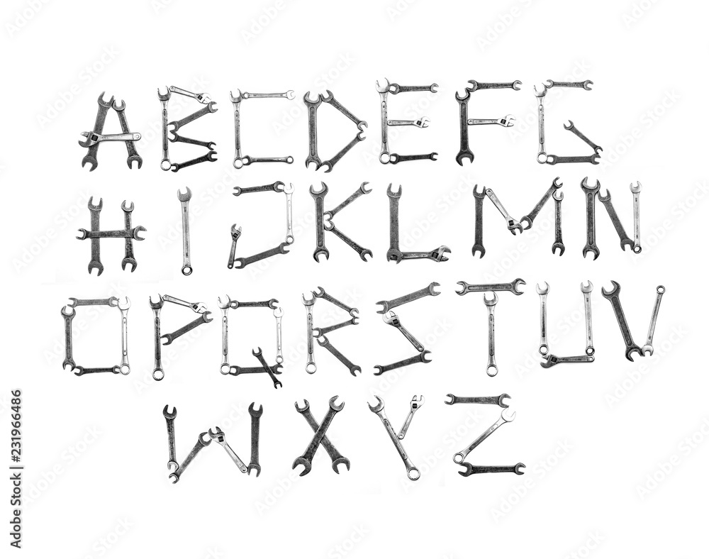 Alfabet letters written with metal wrench tools. Flat lay view. Alfabet letters written with metal wrench tools. Flat lay view.