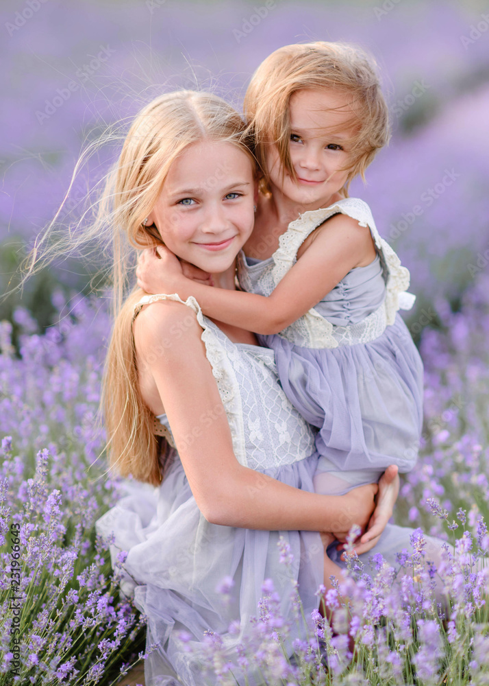 portrait of two sisters in a lavender field portrait of two sisters in a lavender field
