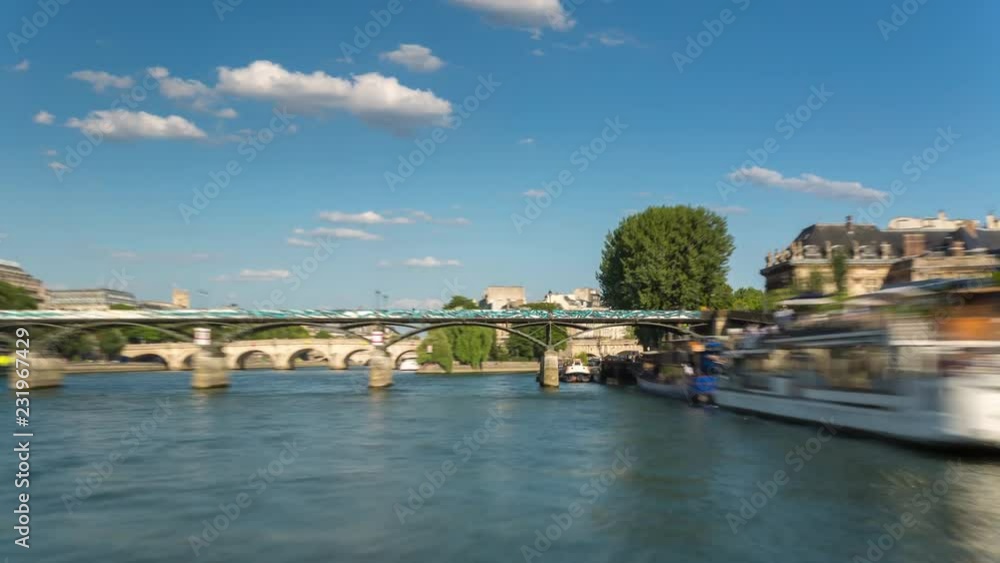 PARIS, FRANCE - JUNE 19, 2018: Timelapse view from the boat sailing the Seine river sunny summer day PARIS, FRANCE - JUNE 19, 2018: Timelapse view from the boat sailing the Seine river sunny summer day