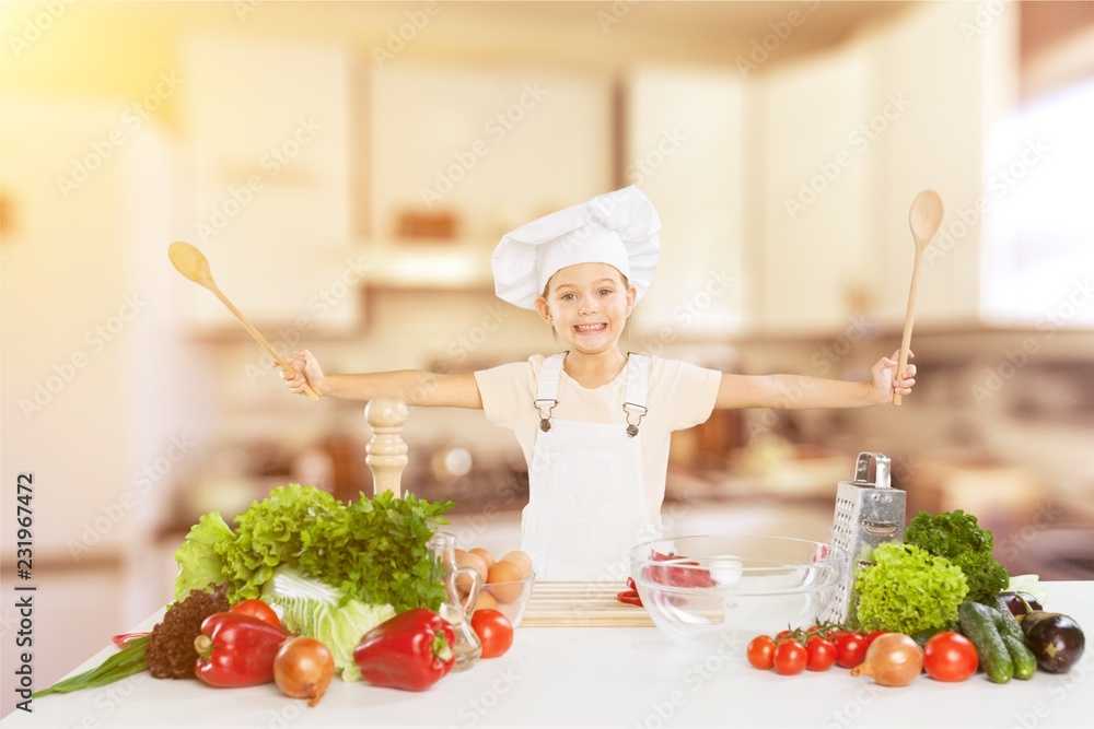 Portrait of adorable little girl preparing healthy food at Portrait of adorable little girl preparing healthy food at
