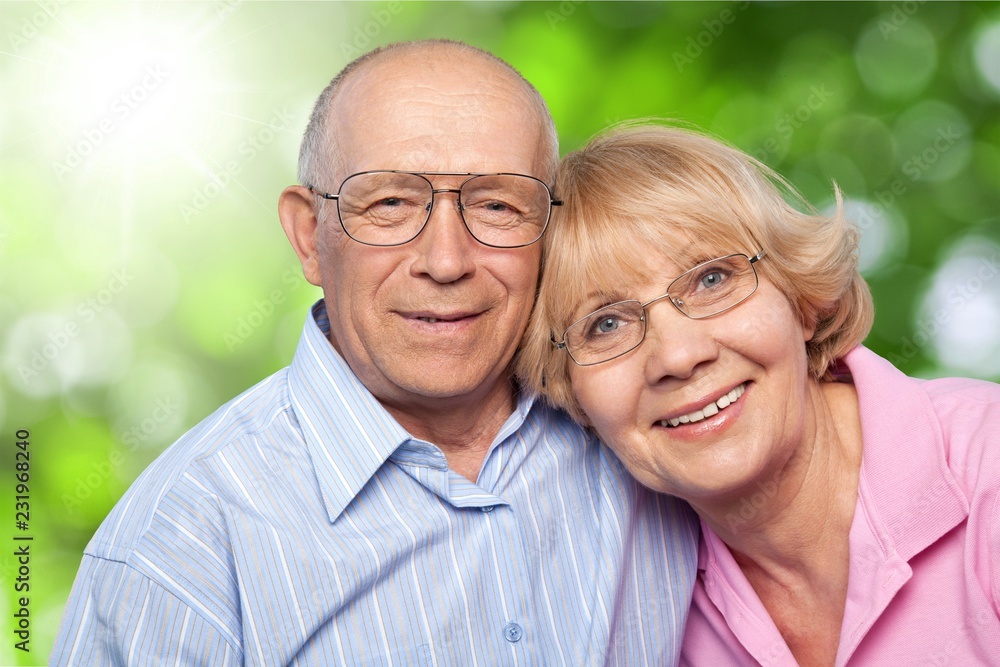 Portrait of happy senior couple smiling at home Portrait of happy senior couple smiling at home