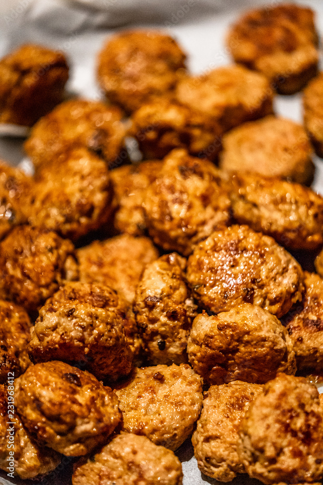 Baked Round Pork Cutlets Spread out on Baking Paper for Some Burgers for Wedding Meal Baked Round Pork Cutlets Spread out on Baking Paper for Some Burgers for Wedding Meal
