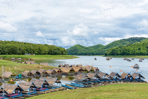 Bamboo raft shelter are floating restaurant in the middle of water under the blue sky as a tourist attraction at Huai Krathing Reservoir, Loei province, Thailand