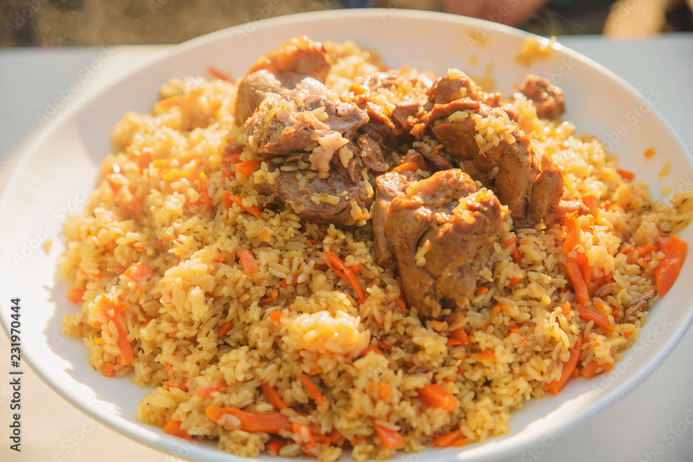 pilaf and other dishes in the cauldron. Methods and ingredients for cooking pilaf. Lamb and beef in Eastern cuisine pilaf and other dishes in the cauldron. Methods and ingredients for cooking pilaf. Lamb and beef in Eastern cuisine