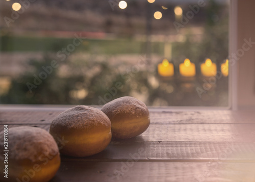 Hanukkah Celebration Concept-Donuts and Candlelights Reflection photo