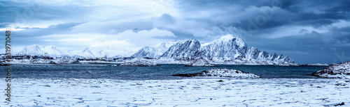 Landscape with beautiful winter sea and snowy mountains at Lofoten Islands in Northern Norway. Panoramic view