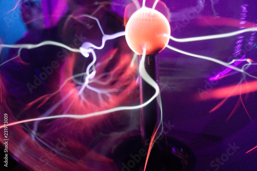 Plasma ball with hand touching