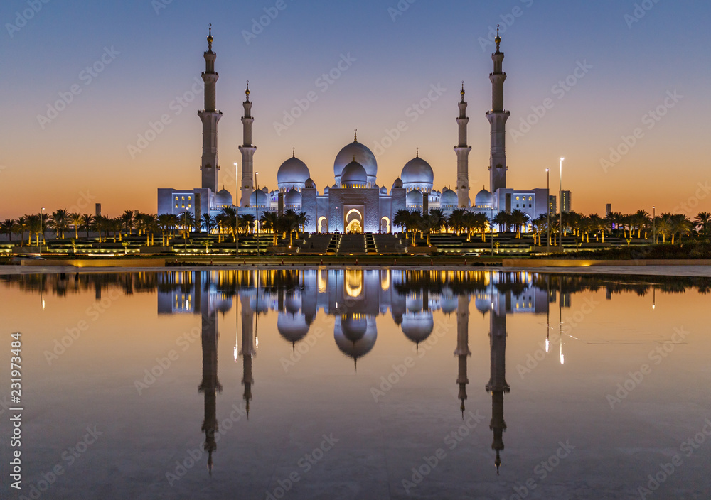 The Sheikh Zayed Grand Mosque in Abu Dhabi after sunset with reflection