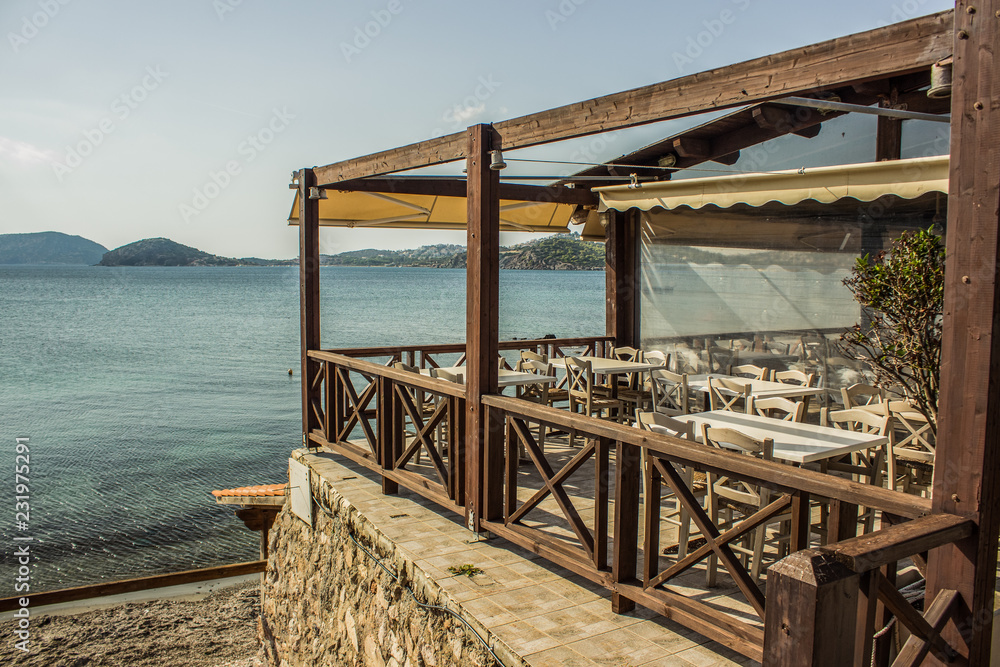 outdoor patio cafe exterior design balcony space with empty wooden furniture table and chairs near sea shore south nature landscape outdoor patio cafe exterior design balcony space with empty wooden furniture table and chairs near sea shore south nature landscape