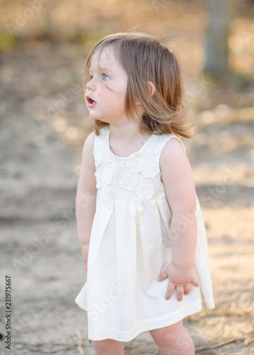 portrait of little girl outdoors in summer