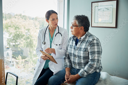 Doctor speaks with male patient