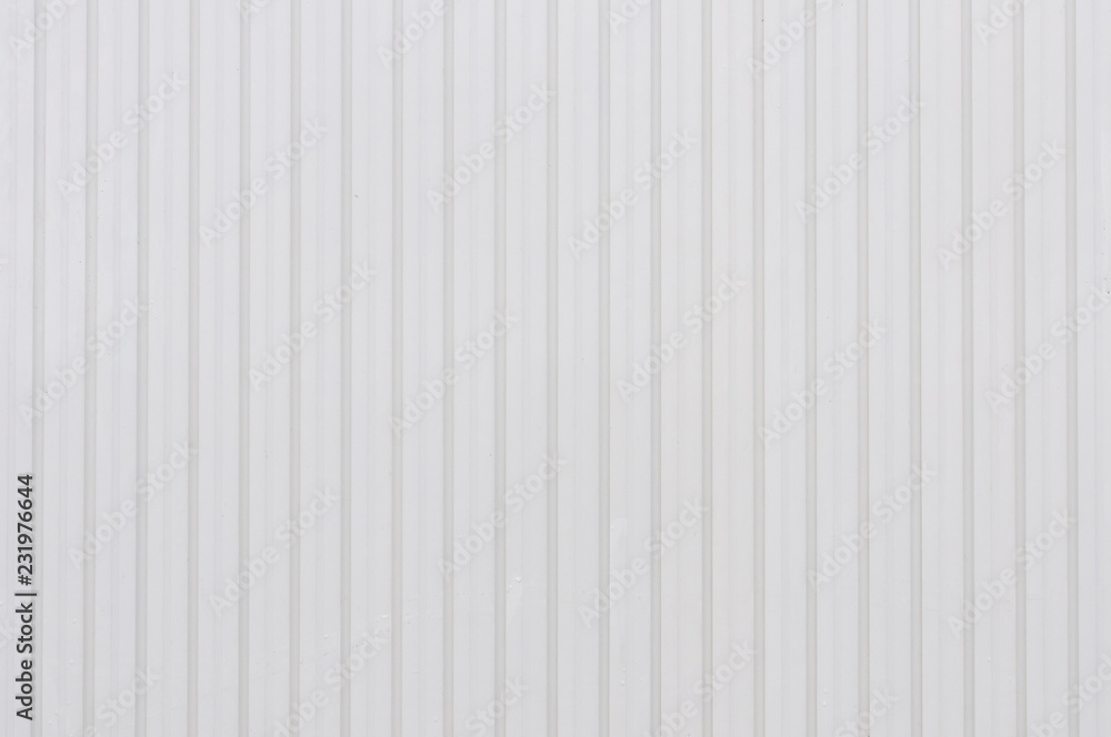 Eine helle Wand aus Holzlatten als Hintergrund Eine helle Wand aus Holzlatten als Hintergrund