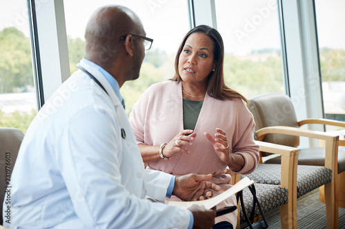 Doctor speaking with female patient