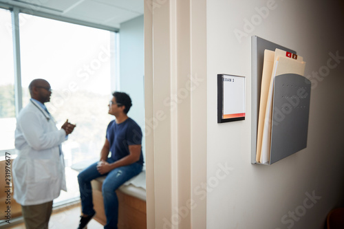 Doctor talking with male patient