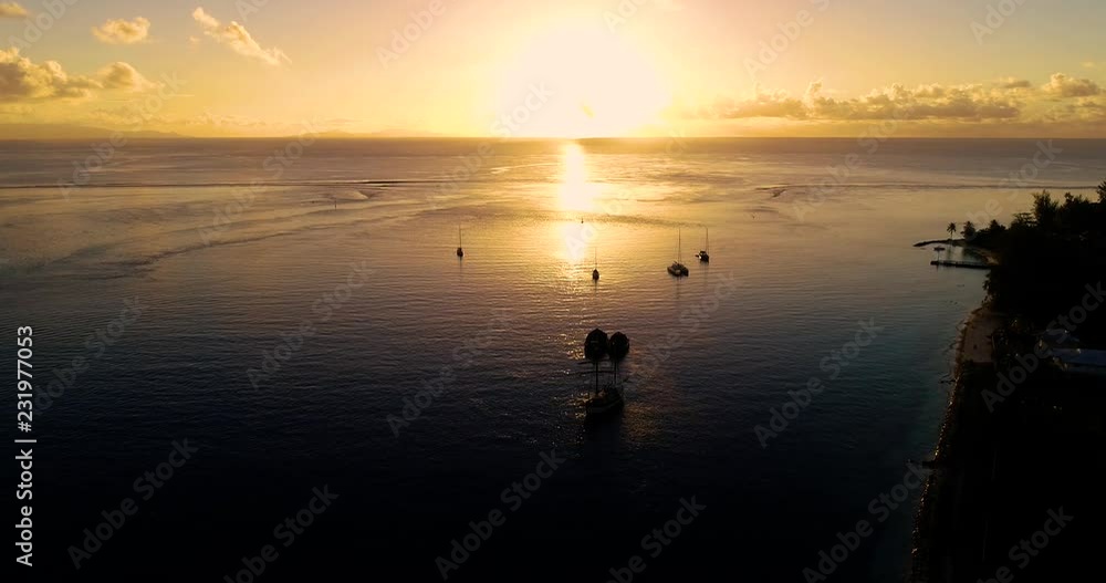 boat with Sunset in aerial view , french polynesia boat with Sunset in aerial view , french polynesia