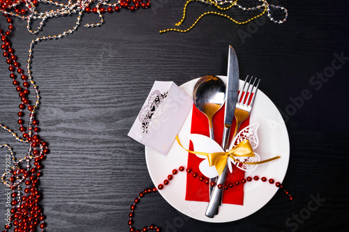 festive Christmas table place setting on wooden background photo