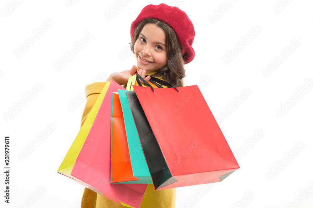 Heavy bags. Small girl with shopping bags. Little shopper. Small child with paper bags. Girl child enjoy shopping. Little shopaholic with paperbags. Shopping is an addiction