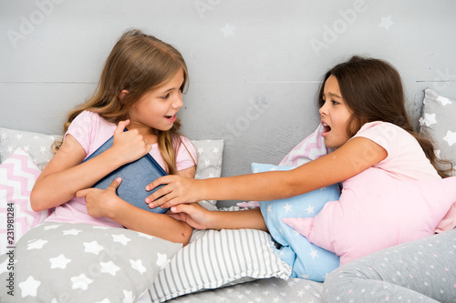 Kids lay in bed fight for book. Friends have some problems. Steps for dealing with sibling rivalry. There is no harm in bit of healthy sibling rivalry when you are children. Sisters rivalry concept