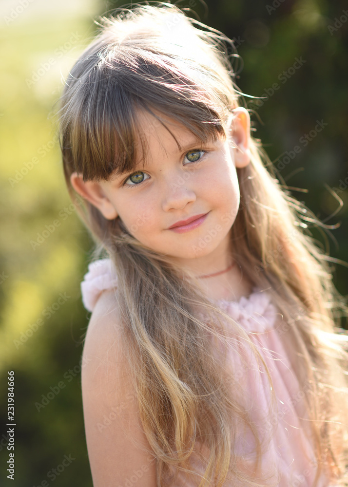 portrait of little girl outdoors in summer portrait of little girl outdoors in summer