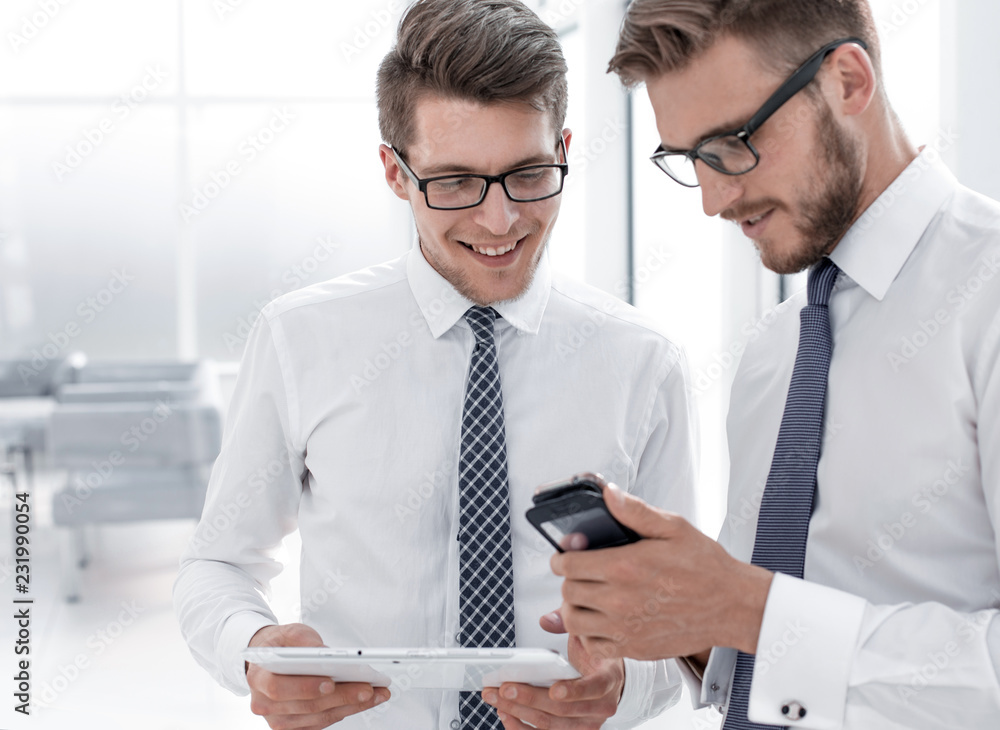 close up.young employees use gadgets in their office close up.young employees use gadgets in their office