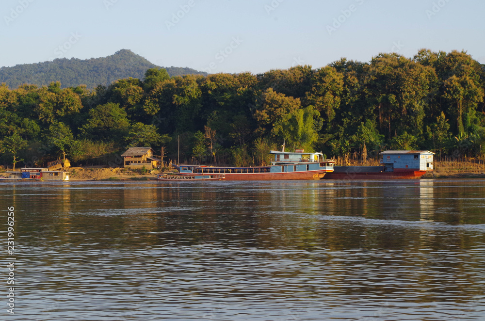 Boats along the Mekong River at dusk - Luang Prabang, Laos