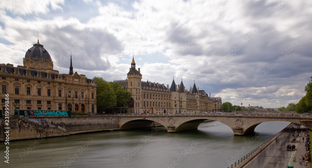 Paris, France - May 1, 2018: Castle Conciergerie - former royal palace and prison. Conciergerie located on the west of the Cite Island and today it is part of larger complex known as Palais de Justice