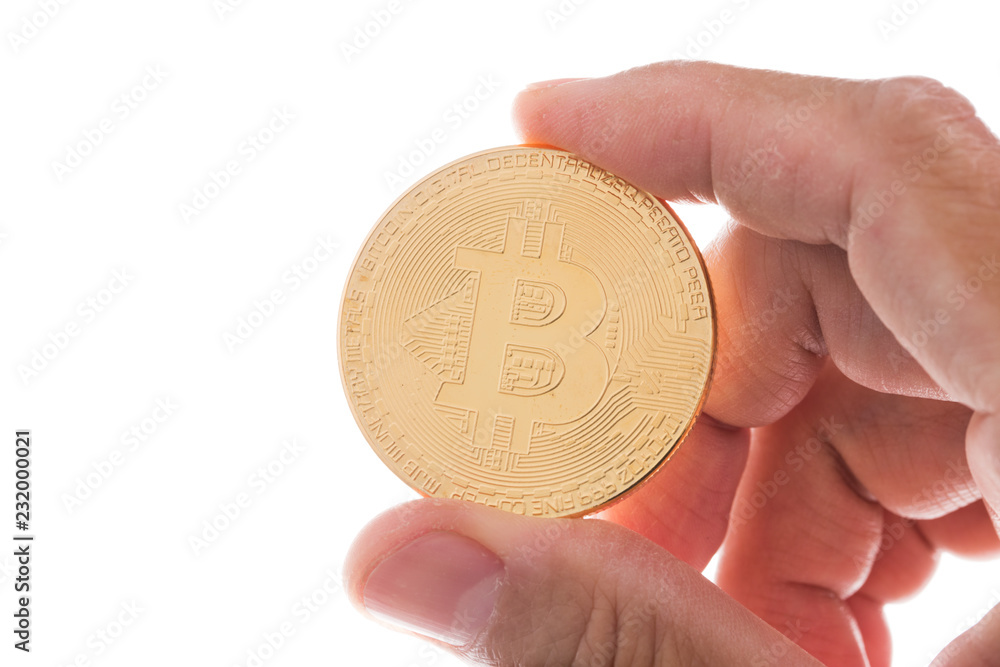 Man hand holding gold bitcion on white background Man hand holding gold bitcion on white background
