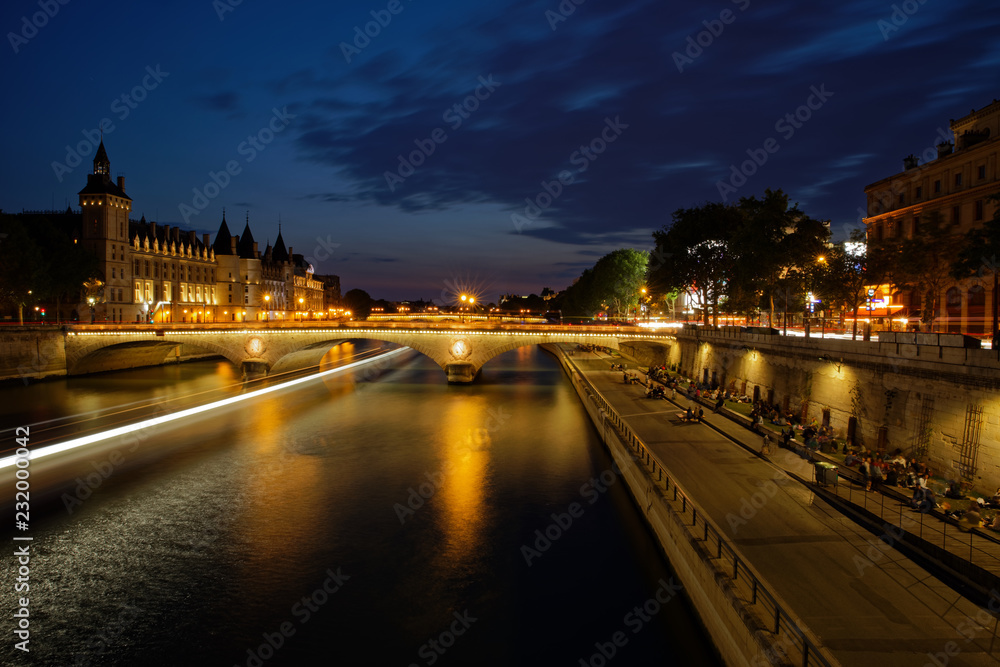 Paris, France - May 20, 2018: The Pont au Change, bridge over river Seine and the Conciergerie, a former royal palace and prison in Paris