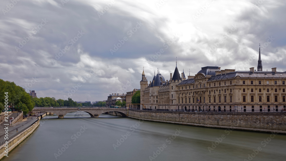 Paris, France - May 25, 2018: Castle Conciergerie - former royal palace and jail. Conciergerie located on the west of the Cite Island and today it is part of larger complex known as courthouse Paris, France - May 25, 2018: Castle Conciergerie - former royal palace and jail. Conciergerie located on the west of the Cite Island and today it is part of larger complex known as courthouse