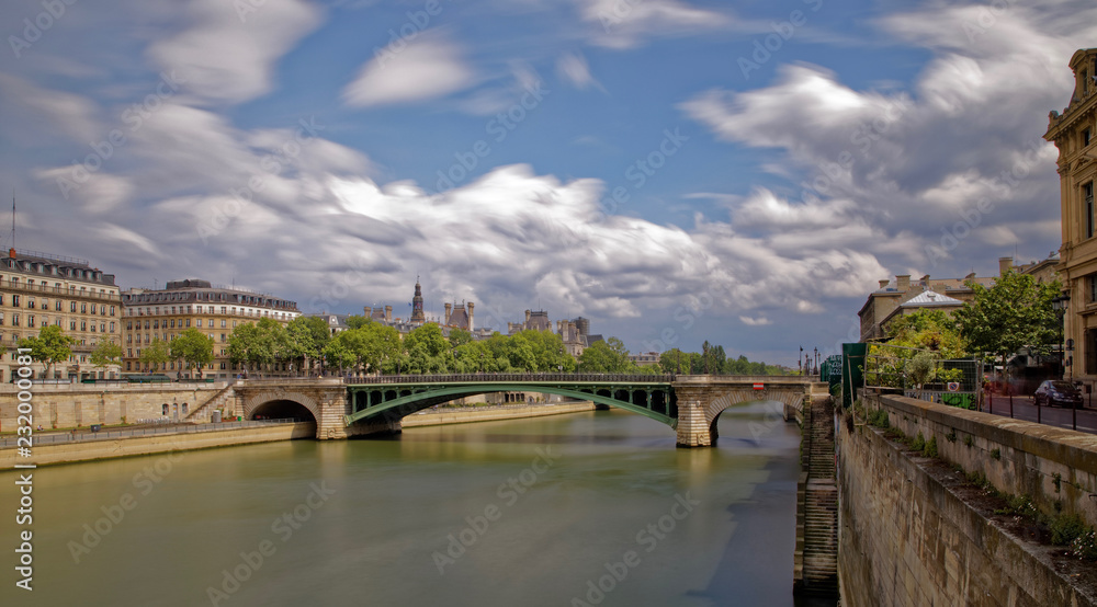 Paris, France - May 25, 2018: Notre dame bridge and Haussman period buildings viewed from river Seine
