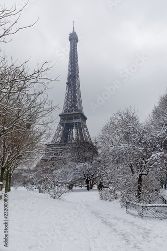Fototapeta Naklejka Na Ścianę i Meble -  Paris, France - February 7, 2018: Eiffel tower and champs de mars covered with snow