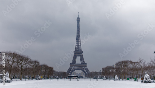 Paris, France - February 7, 2018: Eiffel tower and champs de mars covered with snow