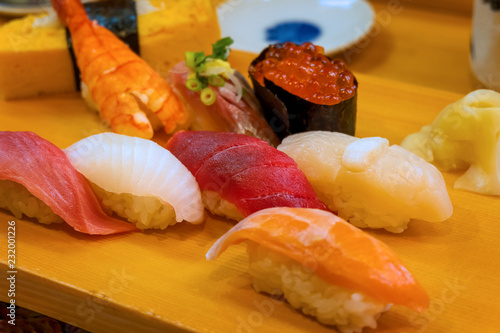 A set of japanese traditional sushi set  beautifully decorated on a wood plate