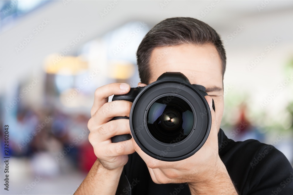 Male Photographer with Camera on  background