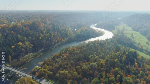 Bridge over the river, Autumn Forest Sigulda city nature, Gauya, 4K drone flight, bridge car drive from above photo