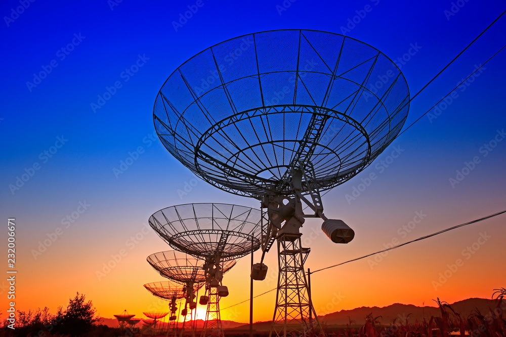 The silhouette of a radio telescope observatory The silhouette of a radio telescope observatory