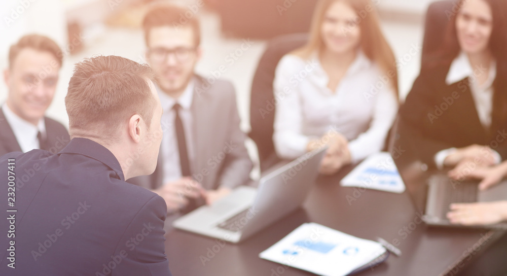 blurred image of business team at a Desk blurred image of business team at a Desk
