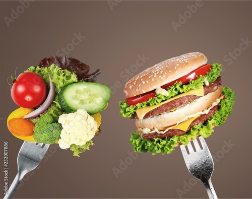 Healthy food and harmful fast food photo