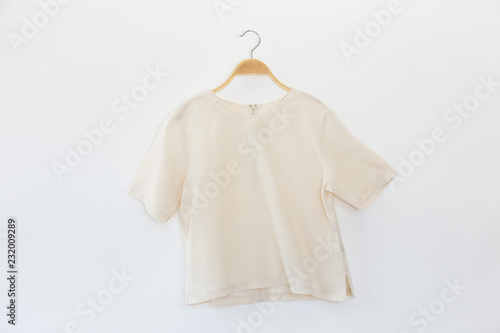 Minimal style.Natural woman clothes is clothes hanger on white background.close up