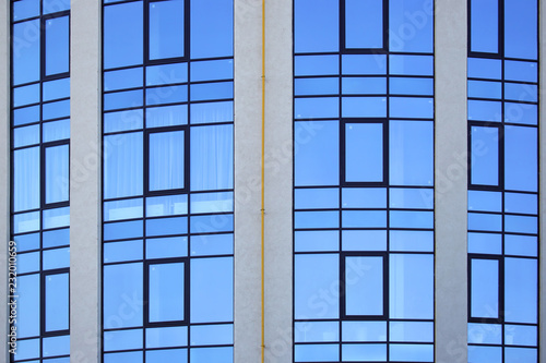 glass facade of the building against the sky