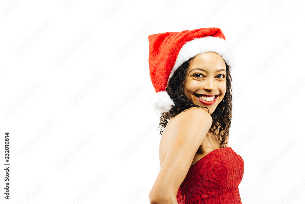 Portrait of a smiling young brunette in Santa Claus hat isolated on white studio background Portrait of a smiling young brunette in Santa Claus hat isolated on white studio background