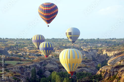 balloon is flying in mountainous area in Cappadocia. Turkey