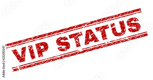 VIP STATUS seal print with corroded texture. Red vector rubber print of VIP STATUS text with grunge texture. Text caption is placed between double parallel lines.